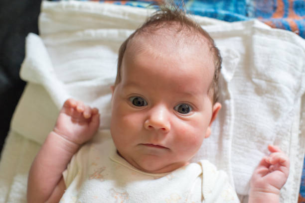 istock The newborn (one month old baby) lying on the bed 1066122610