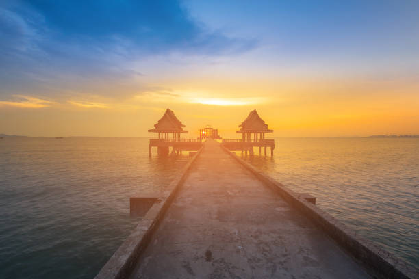 istock Sunset over ocean and walking way leading to sea 1066124370