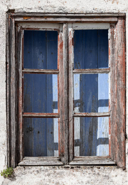 istock old window of abandoned house in ruins 1066126486