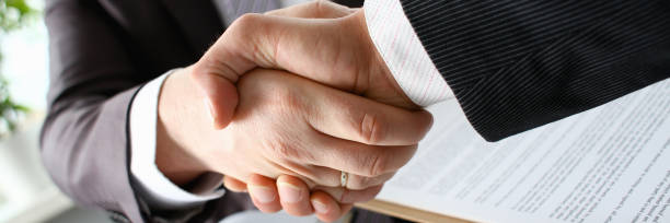 istock Man in suit shake hand as hello in office 1066126624