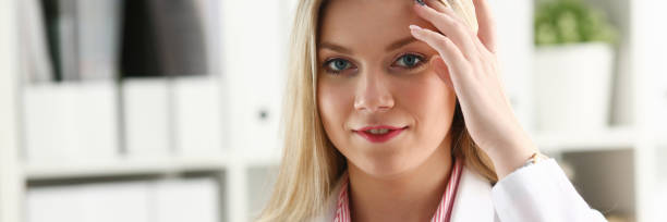 istock Beautiful smiling female doctor sit at workplace 1066132200