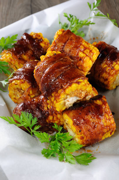 istock Grilled corn wrapped with bacon slices under BBQ sauce 1066132330