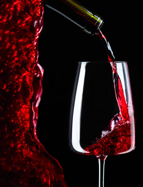 istock Red wine being poured into wineglass. 1066132954