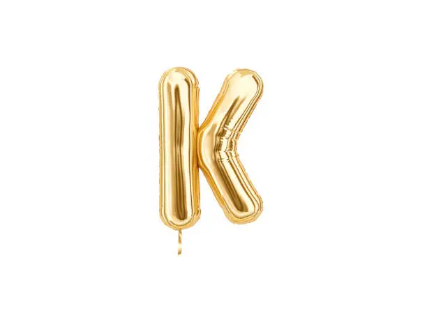 Gold foil alphabet, Letter K isolated on white background