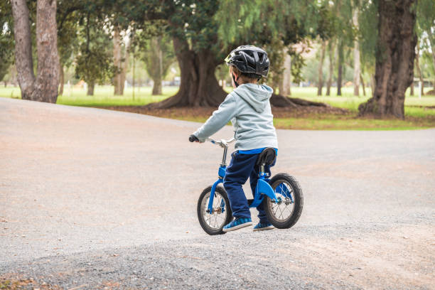 istock Kid riding balance bike 1066147234