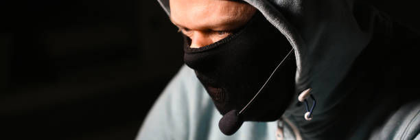 istock Man carder in mask connect to darknet 1066150592