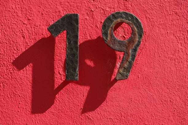 istock House number plate number nineteen 1066158044