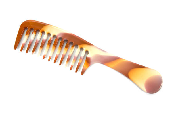 Large hair comb with handle isolated on white background.