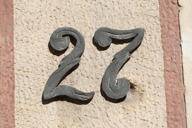 istock House number plate number twenty-seven 1066158546