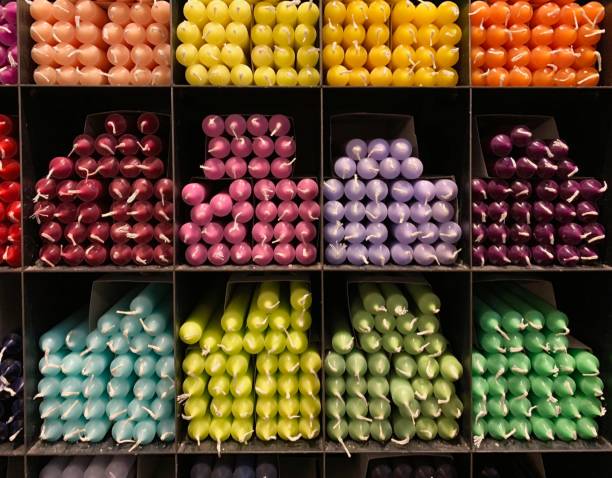 Colorful candles in the shelves