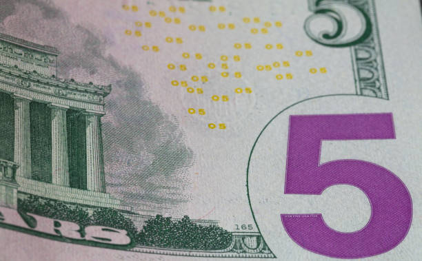 istock fragment of 5 dollar bill 1066159336