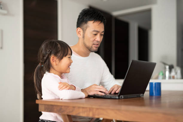 istock Father working from home with daughter 1066159600