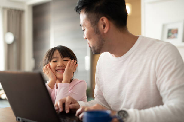 istock Father working from home with daughter 1066159788