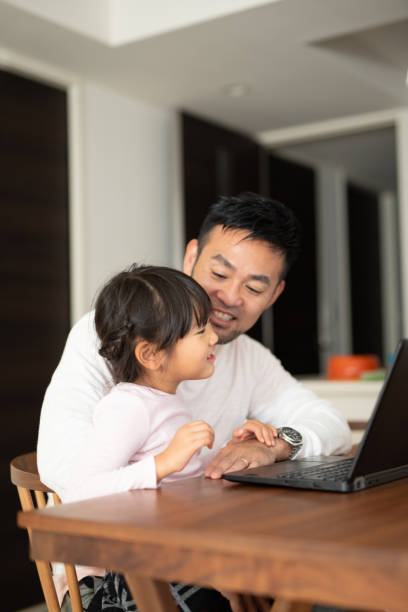 istock Father working from home with daughter 1066160074