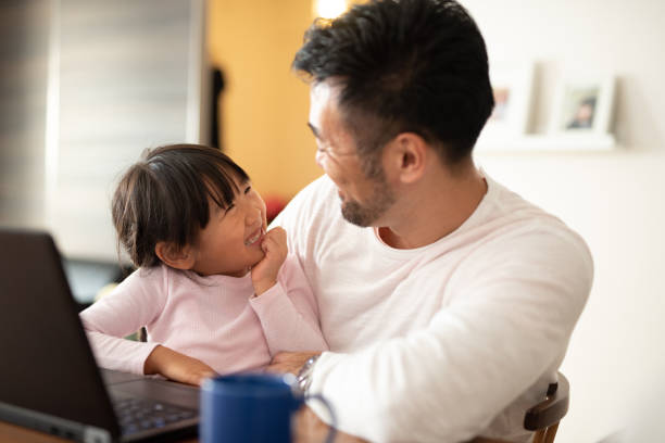 istock Father working from home with daughter 1066160184