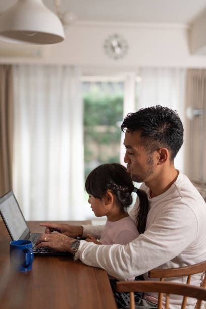 istock Father working from home with daughter 1066160248