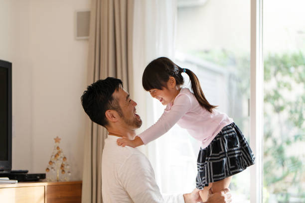 istock Father embracing daughter at home 1066160612