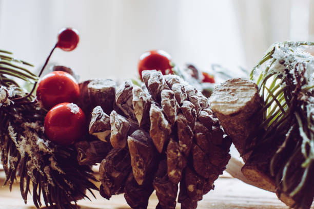 istock Scandinavian Christmas wreath with red berries and pine cones 1066160818