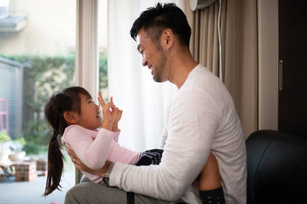 istock Father embracing daughter at home 1066161020