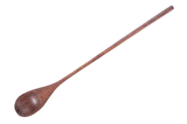 istock Wood spoon long handle isolated on white background. Long wood spoon isolated 1066163292