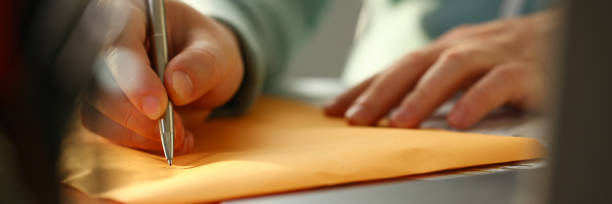 istock Male hand holding silver pen 1066167092