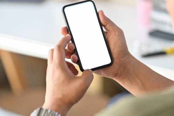 istock Businessman using smart phone in office. 1066173924
