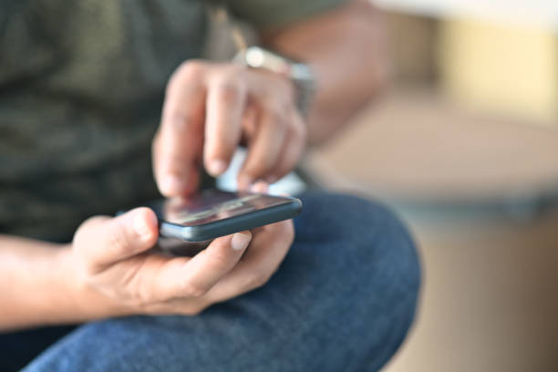 istock Closes-up man hand holding mobile smartphone. 1066174020