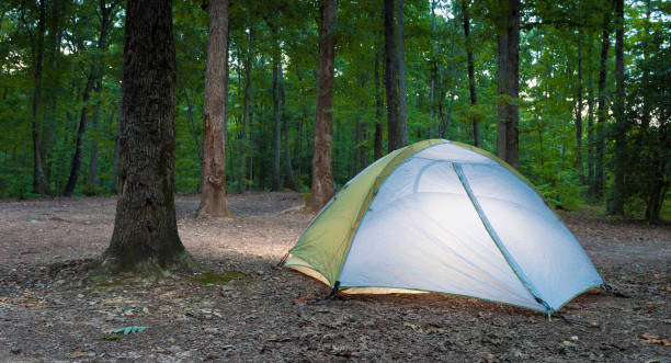 istock Tent lighted before dusk on Uwharrie National Forest 1066179238