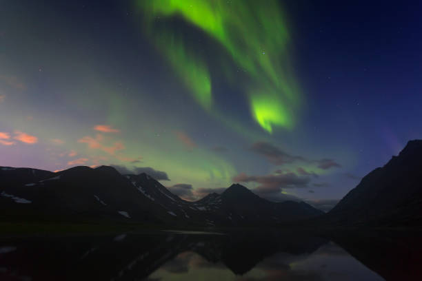 istock Aurora in the night sky cut the mountains. Yamal. 1066185886