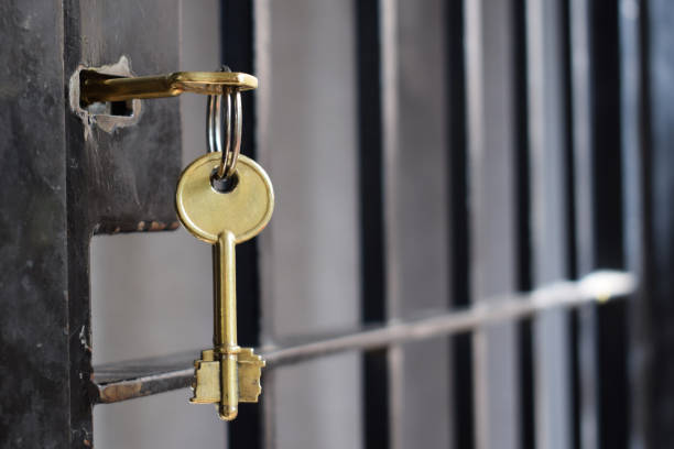 istock key in an iron door 1066189058