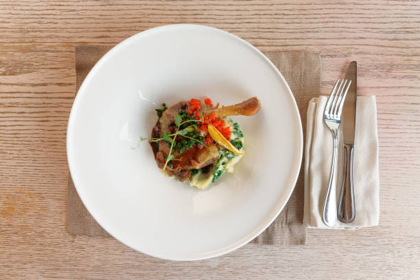 istock Broiled duck leg with creative decoration shot from above 1066189518