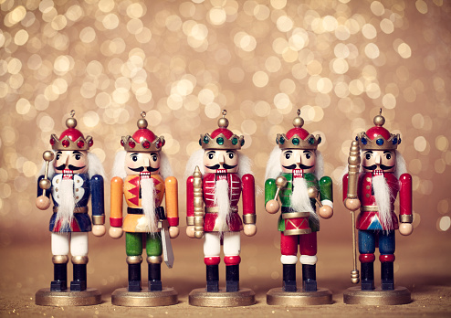 Christmas nutcrackers on a defocused golden lights background