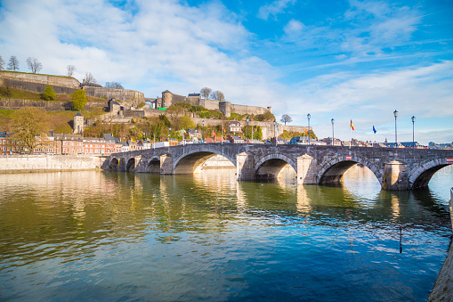 Classic view of the historic town of Namur with famous Old Bridge crossing scenic River Meuse in summer, province of Namur, Wallonia, Belgium