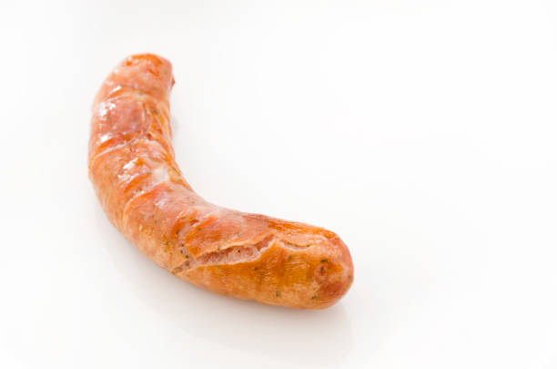 istock Delicious sausages on white background. 1066196762