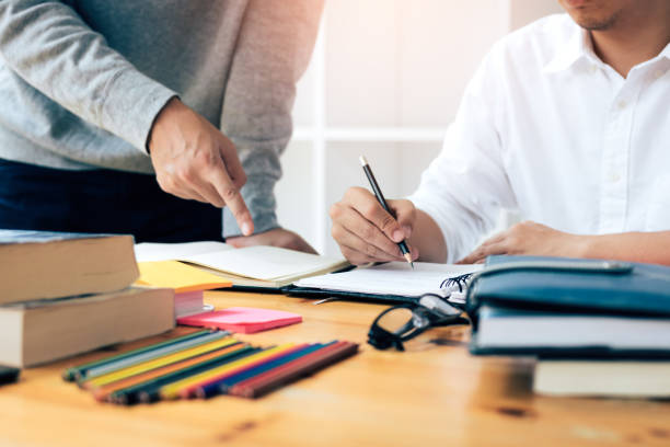 istock Group of students are writing a university test. 1066207150