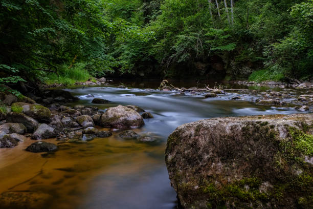 istock long exposure rocky mountain river in summer with high water stream level 1066207802