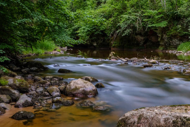 istock long exposure rocky mountain river in summer with high water stream level 1066207822