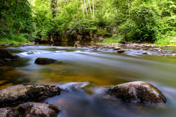 istock long exposure rocky mountain river in summer with high water stream level 1066207848