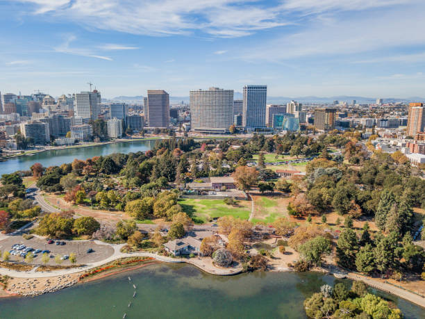 Aerial View of Lake Merritt Aerial view of Lake Merritt and downtown Oakland on a sunny day. Skyscrapers fill the horizon with a bright blue sky. Downtown district fills the waterfront. alameda county stock pictures, royalty-free photos & images
