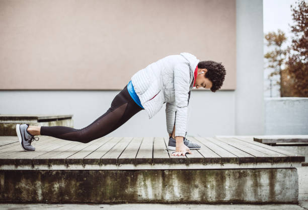 istock Female Athlete Preparing For Exercise 1066210288