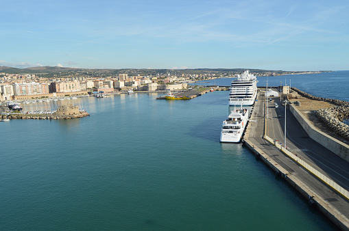 View of stone and concrete breakwaters along the pier, cruise liners and a panorama of the port of Civitavecchia, October 7, 2018.
