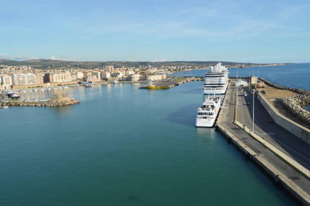 View of stone and concrete breakwaters along the pier, cruise liners and a panorama of the port of Civitavecchia, October 7, 2018 stock photo