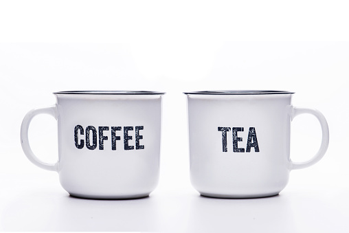 Classic white tea and coffee mug, a cup with black edging and an inscription on a white background.