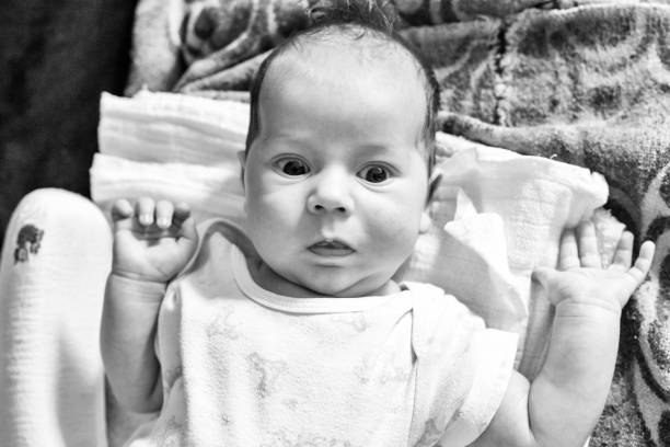 istock The newborn (one month old baby) lying on the bed and enjoys it 1066227346