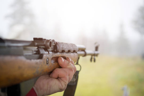 istock Man hands and Russian machine gun 1066229328