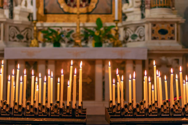 istock Burning candles in the Catholic Church. Selective focus. Bokeh. 1066229984