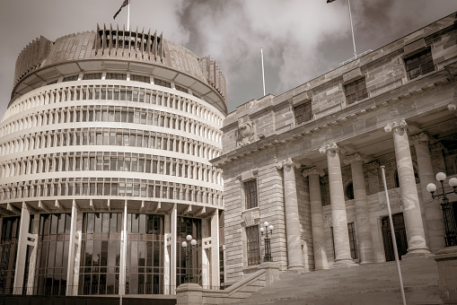 New Zealand Government buildings, House neo classical style House of Parliament with Beehive beside in old-world sepia effect