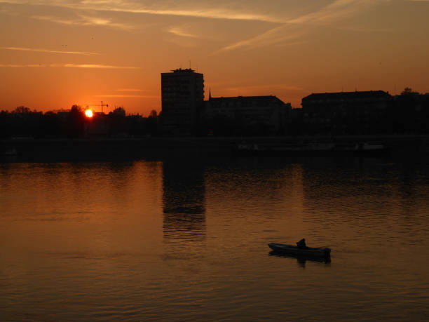 istock Sunset on the river by the city 1066233824
