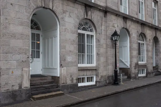 Photo of Entrances to vintage building on wet street