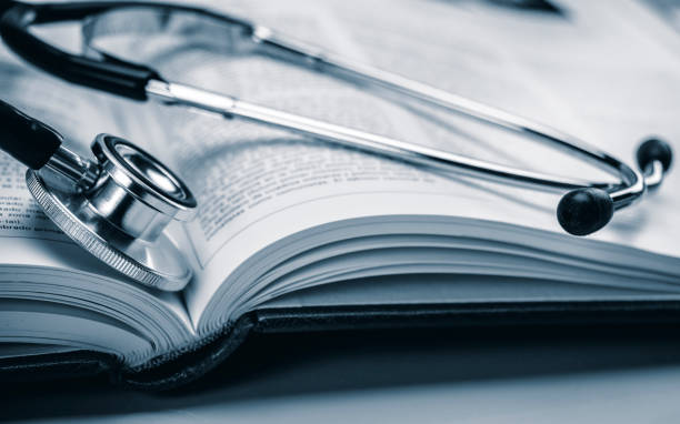 istock Phonendoscope on book of medicine, conceptual image 1066245208